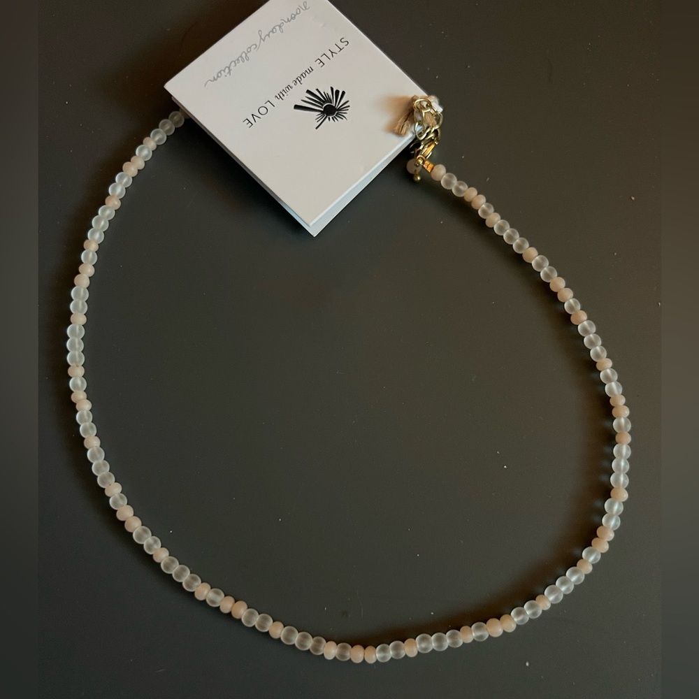 Pink Noonday Collection Necklace with glass beads.